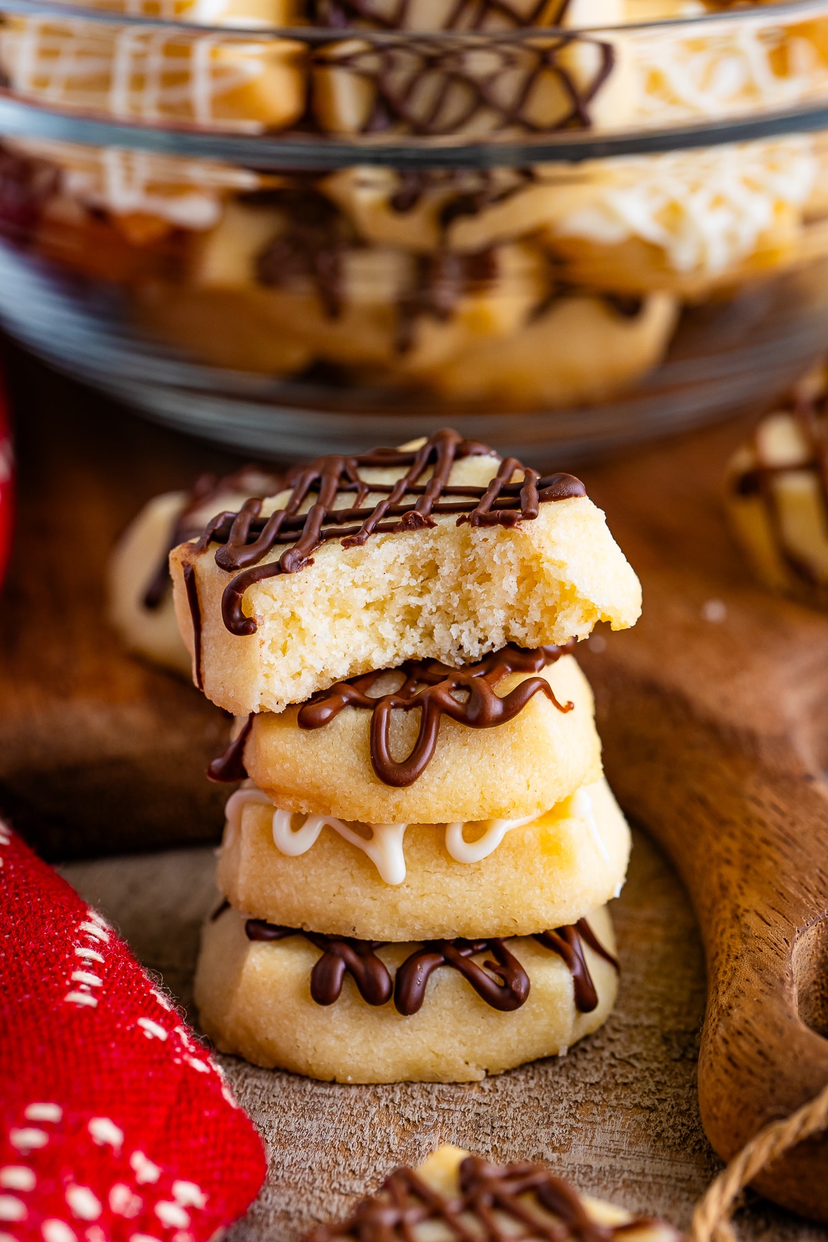 christmas shortbread bites stacked with a bite taken out