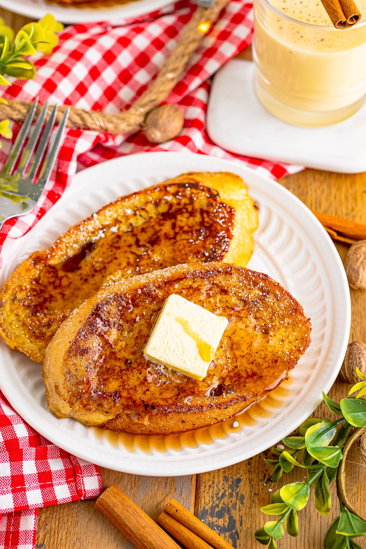 overhead image eggnog french toast on white plates