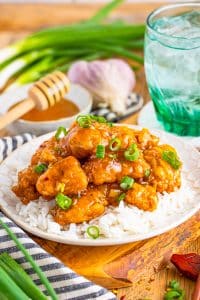 Honey garlic chicken recipe on a tan plate.