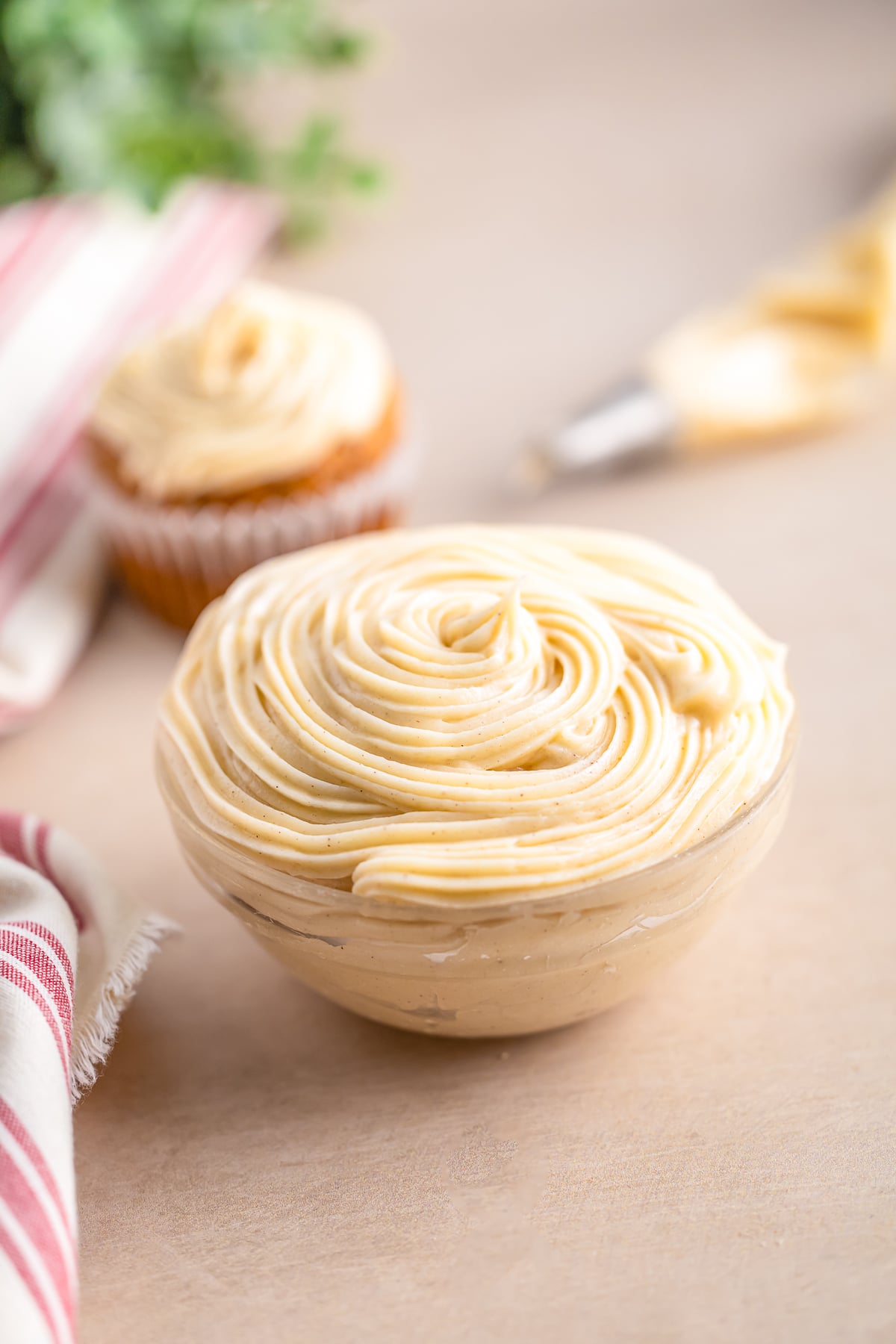 cinnamon cream cheese frosting piped into a small bowl