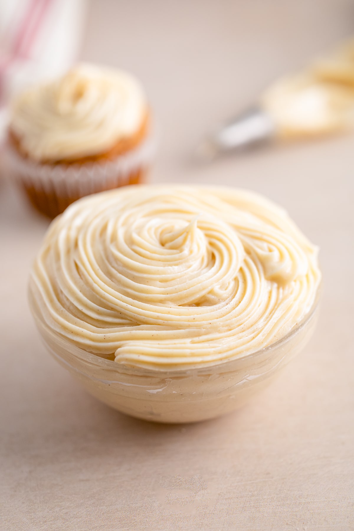cinnamon cream cheese frosting in a small glass bowl