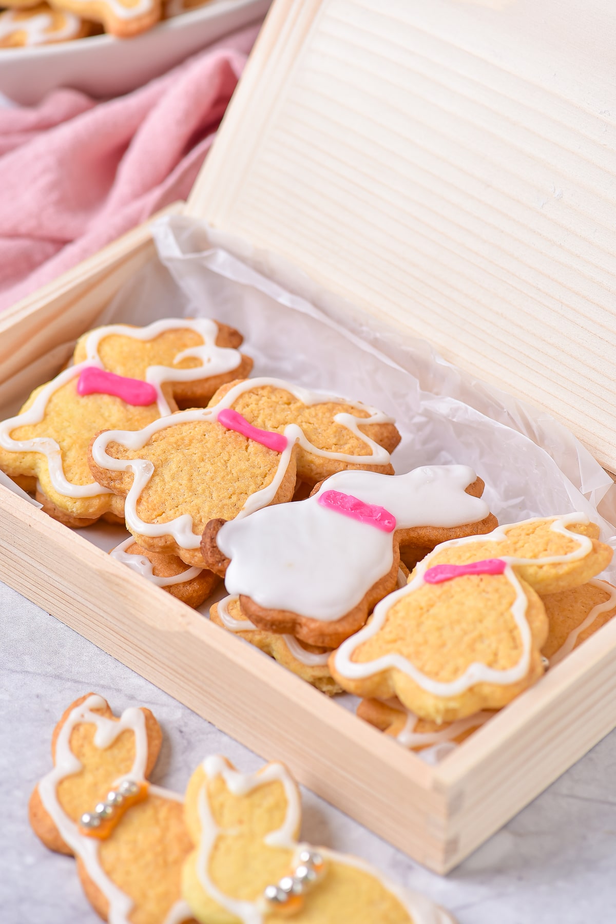 decorated bunny cookies in wooden box