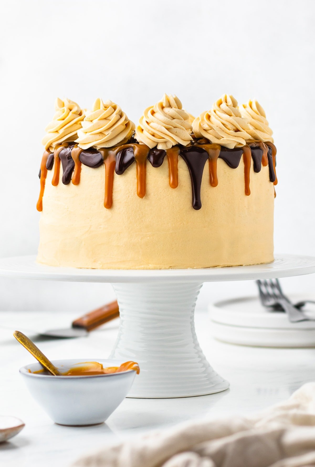 straight on image of chocolate caramel cake on a cake stand