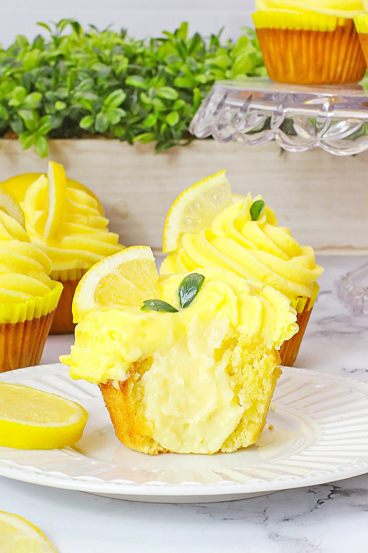lemon cupcakes cut in half to show filling
