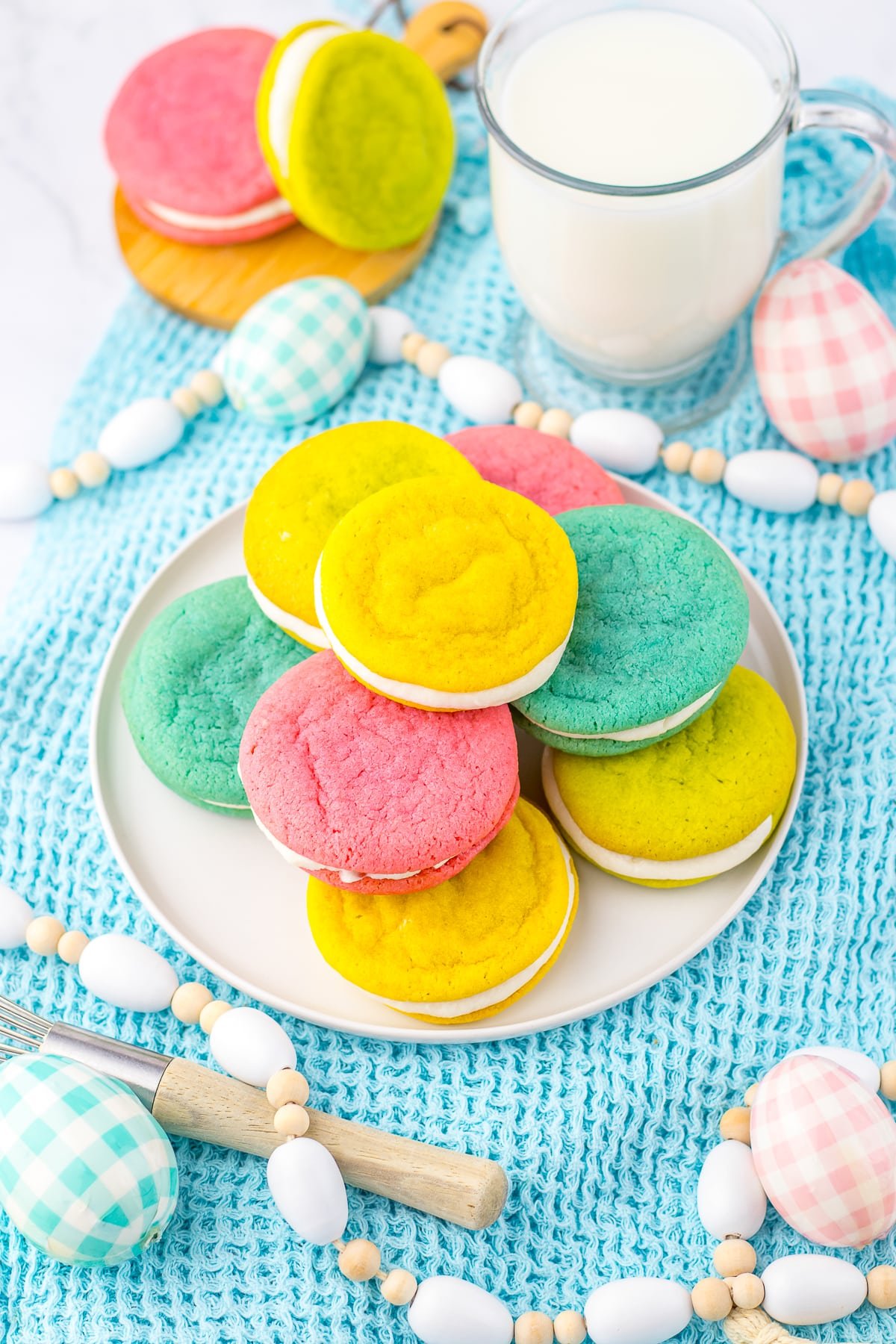 easter sugar cookies sandwiches on a white plate