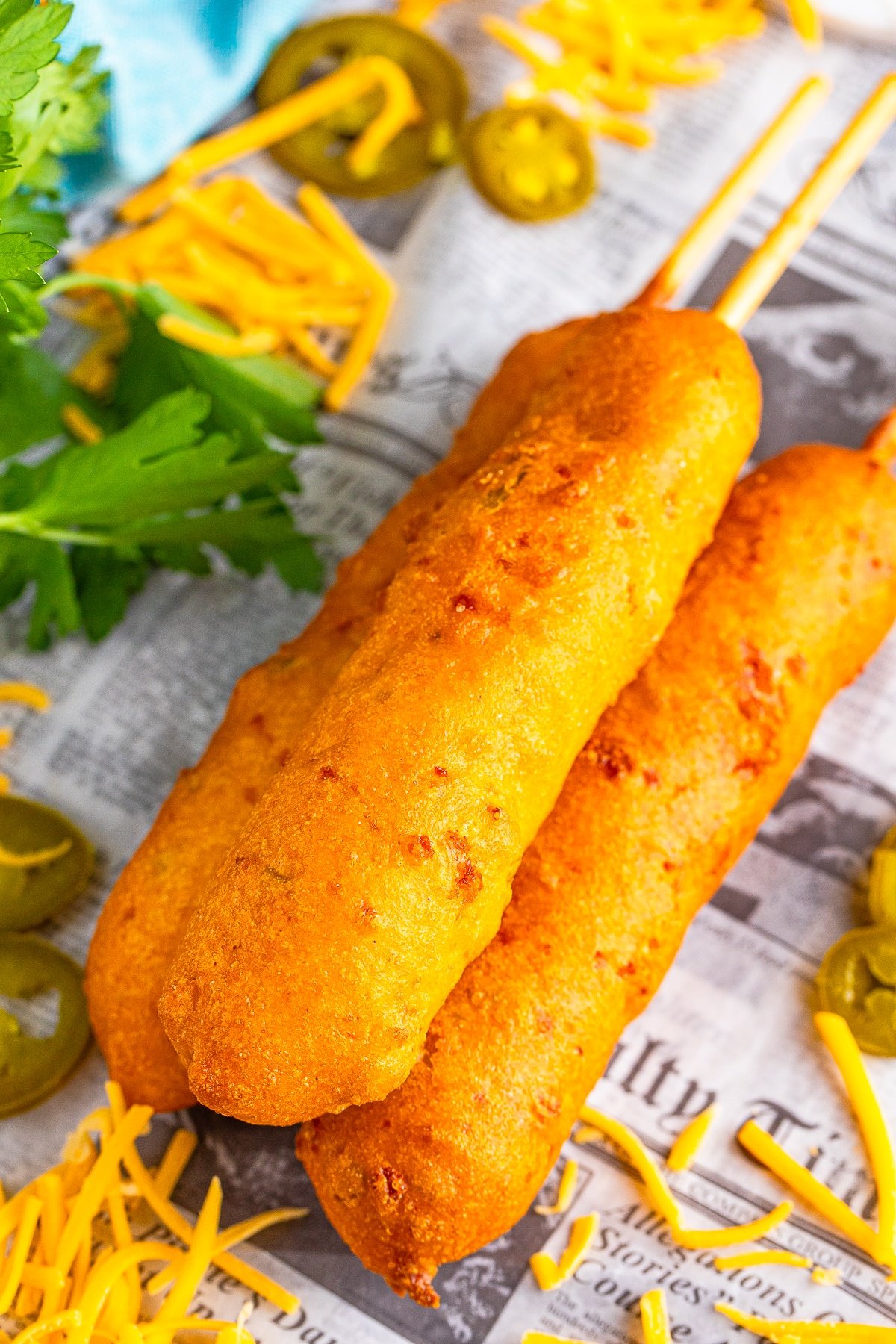 corn dogs recipe stacked on newspaper