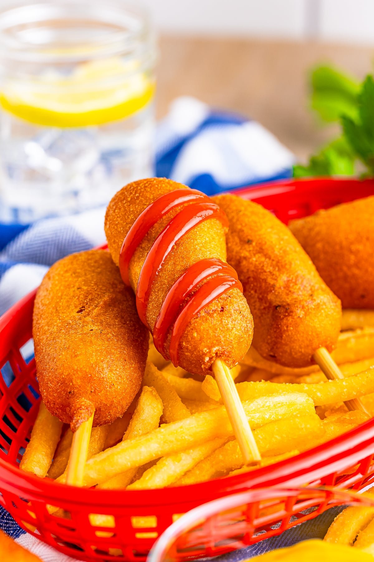 mini corn dogs in a red serving basket