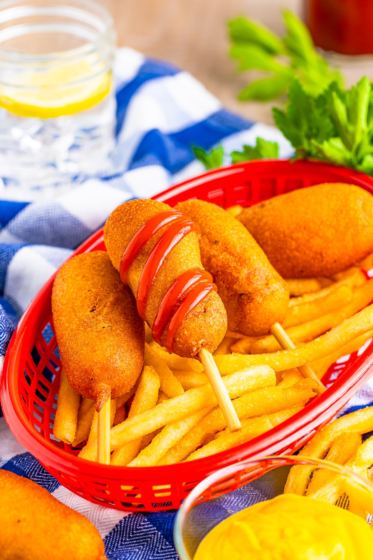 mini corn dogs with ketchup in a serving basket