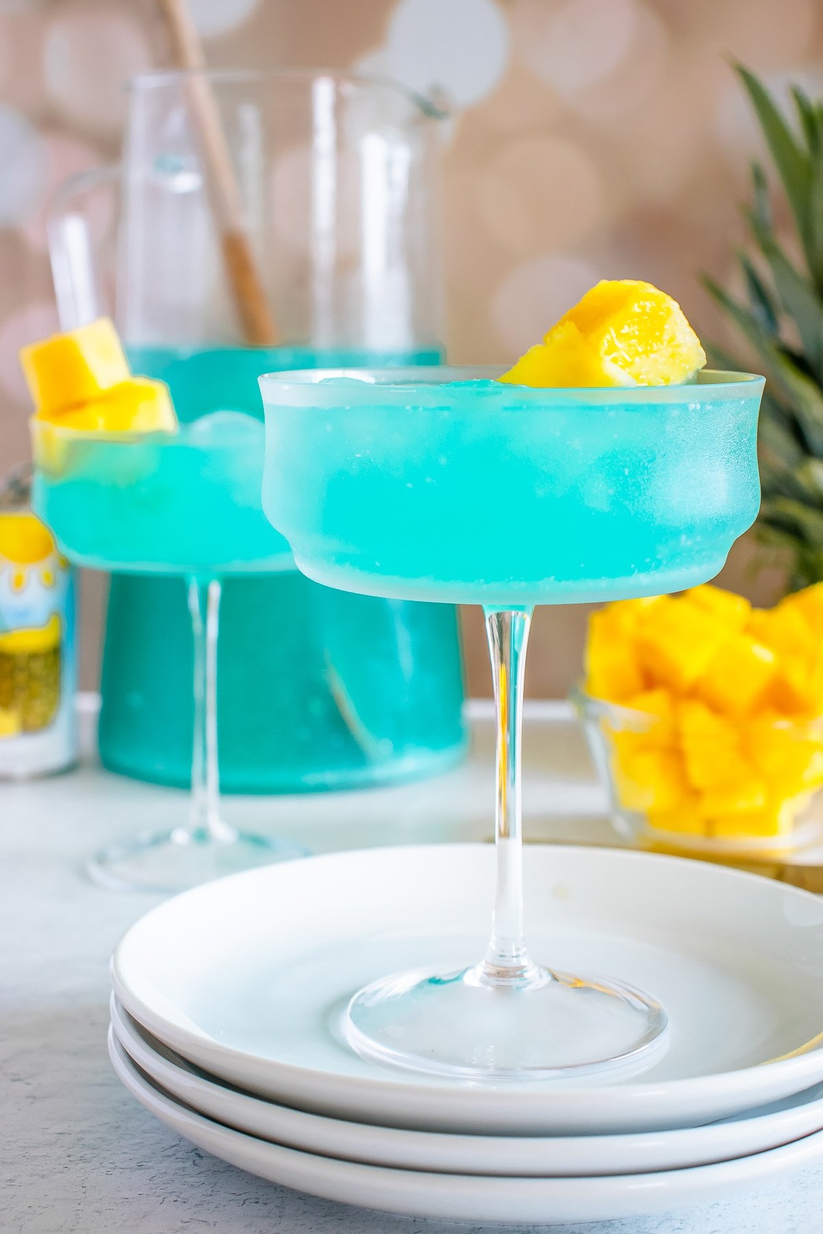 two Blue Hawaiian Cocktail on marble table top