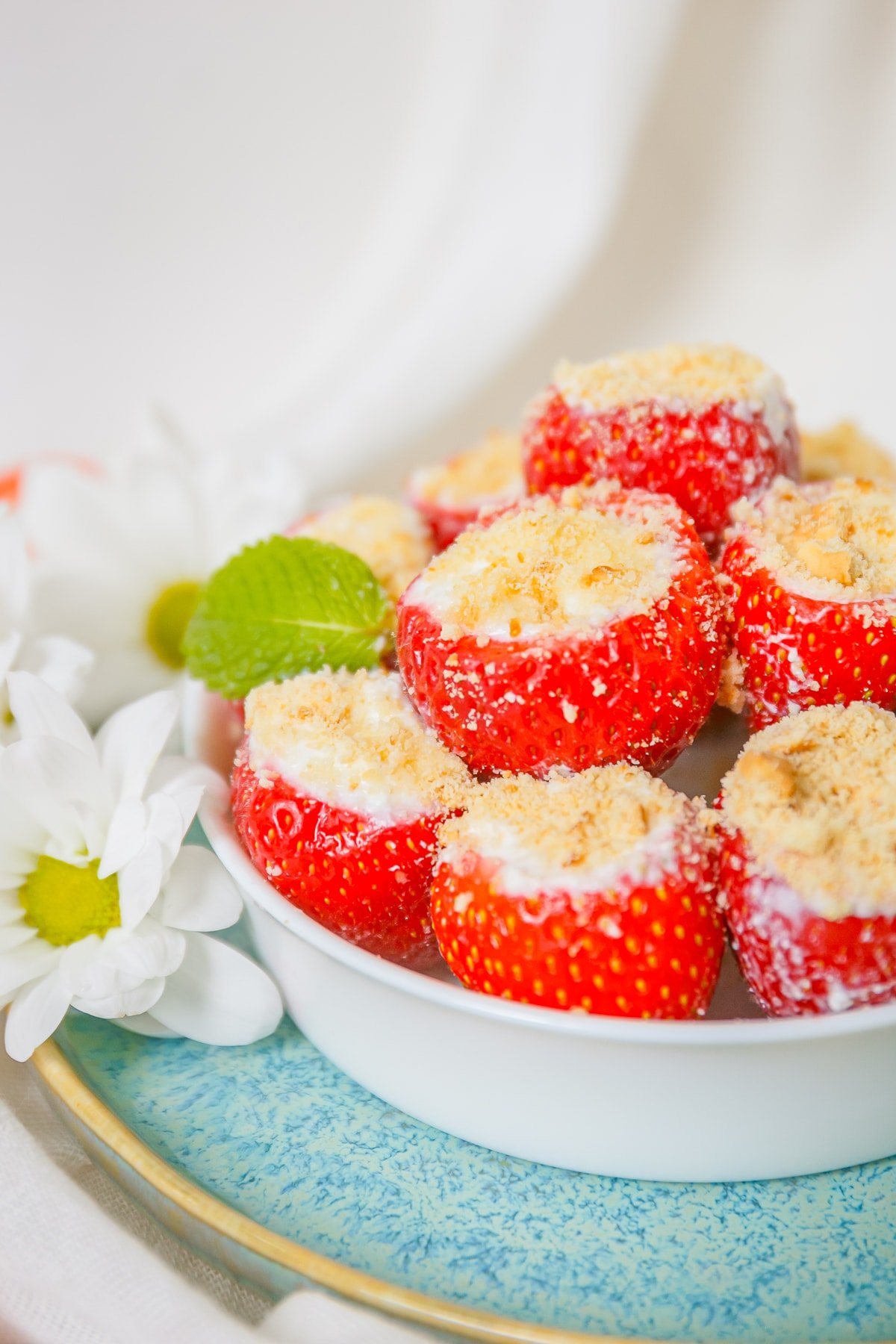 Cheesecake Stuffed Strawberries in a white serving bowl