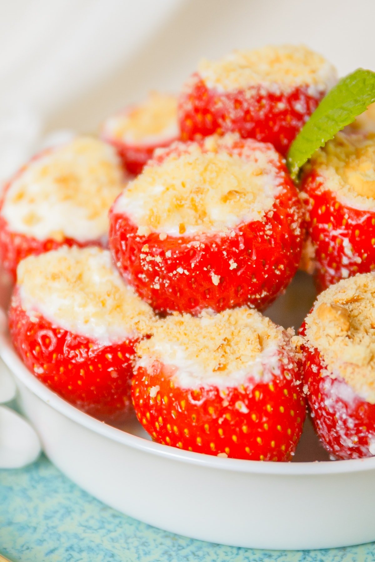 up close image Cheesecake Stuffed Strawberries in bowl