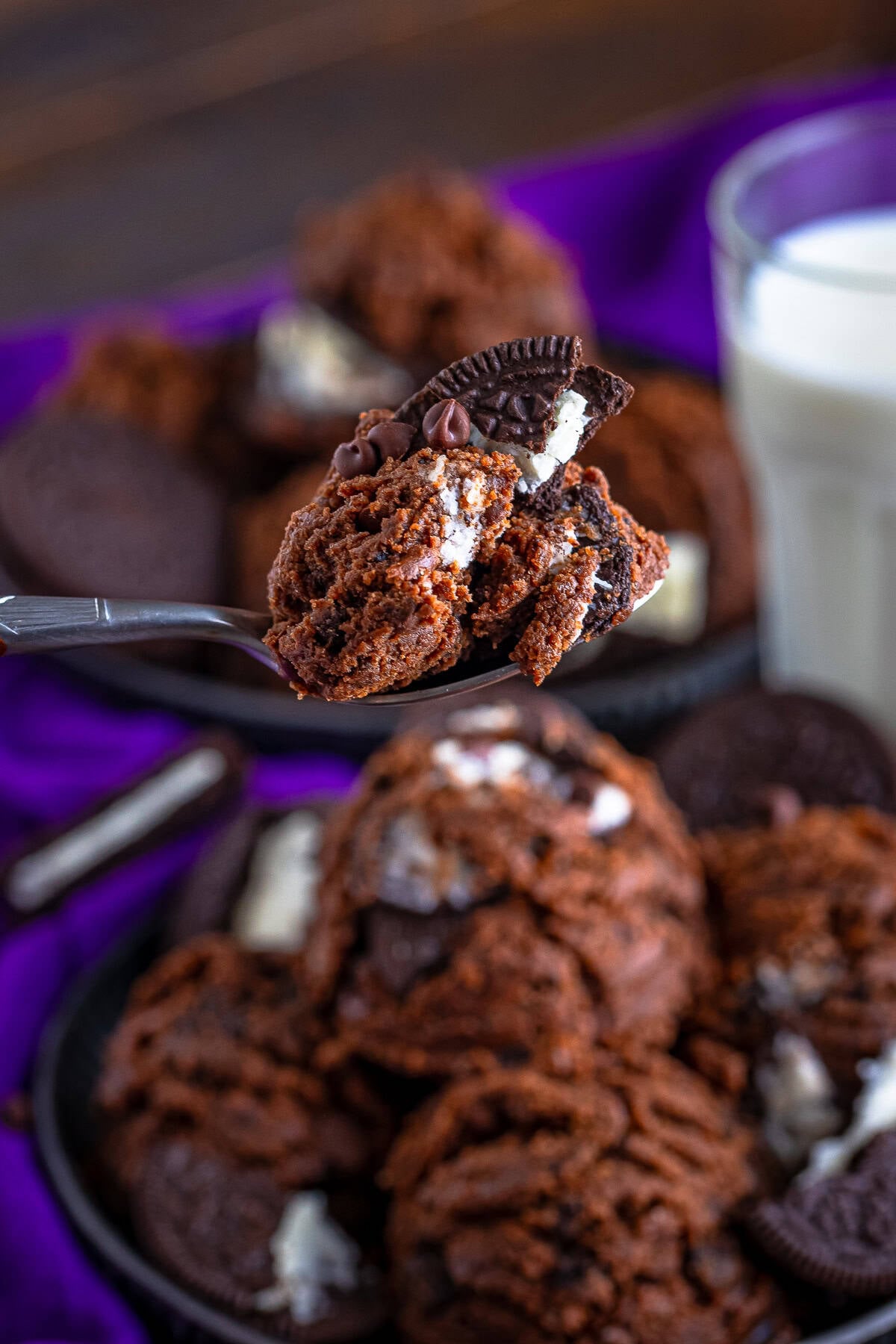a bite of edible chocolate cookie dough on a spoon in air