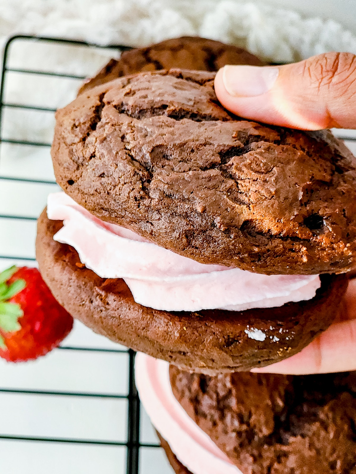 a hand holding up Whoopie Pies Recipe in air