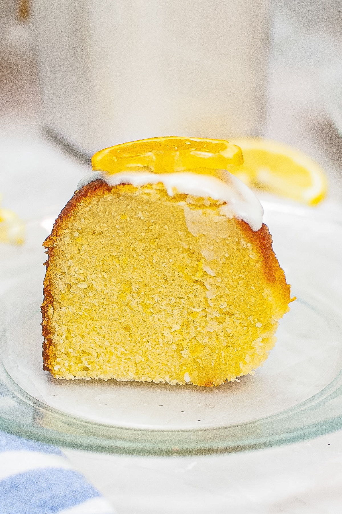 slice of Lemon Bundt Cake on a glass plate