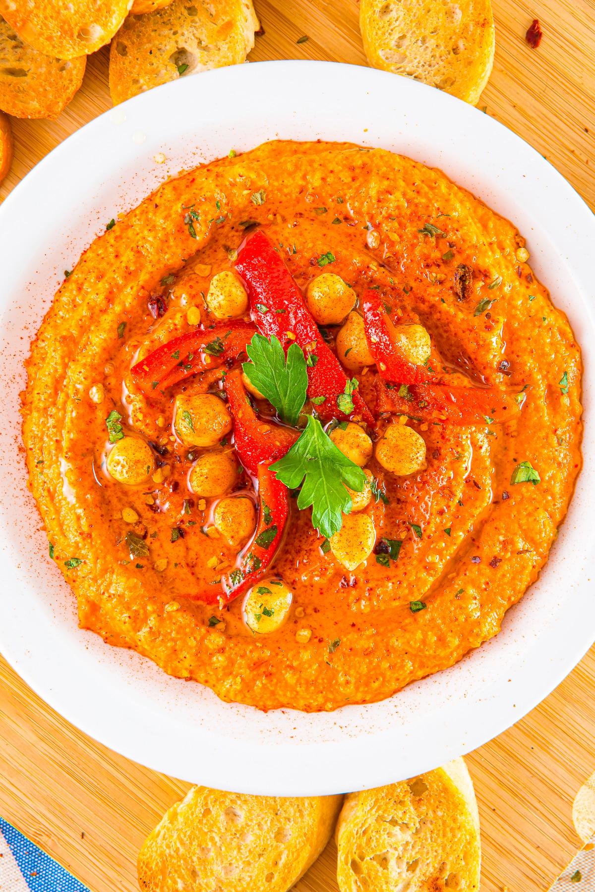overhead image of Red Pepper Hummus on a white plate
