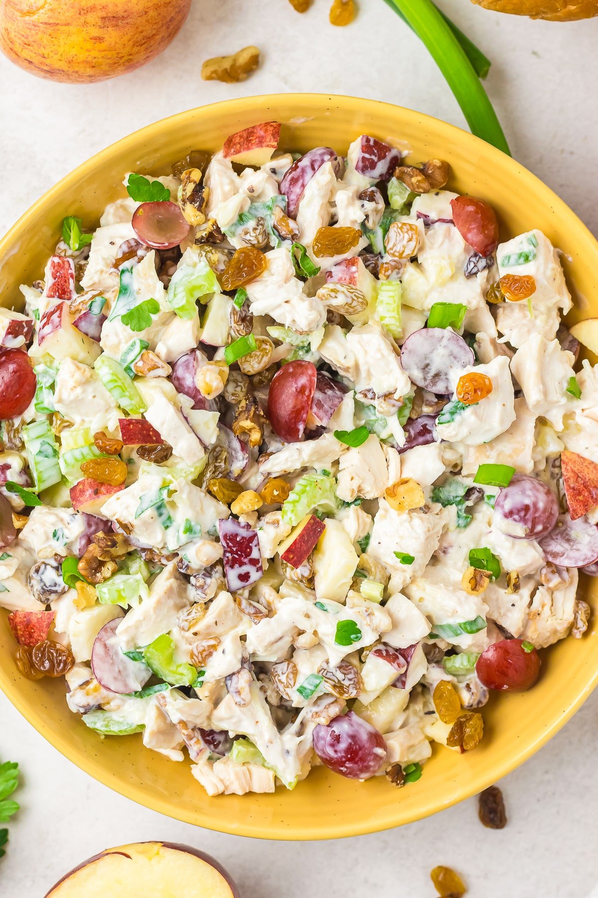 overhead image of Waldorf Chicken Salad in a yellow serving bowl
