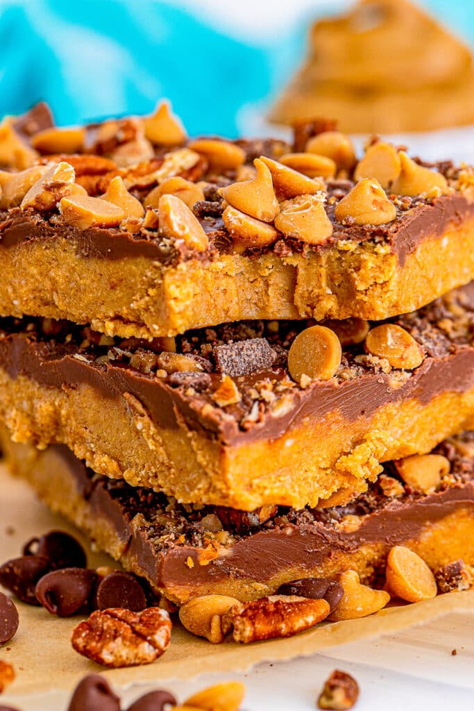 No-Bake Peanut Butter Bars stacked with a bite taken out