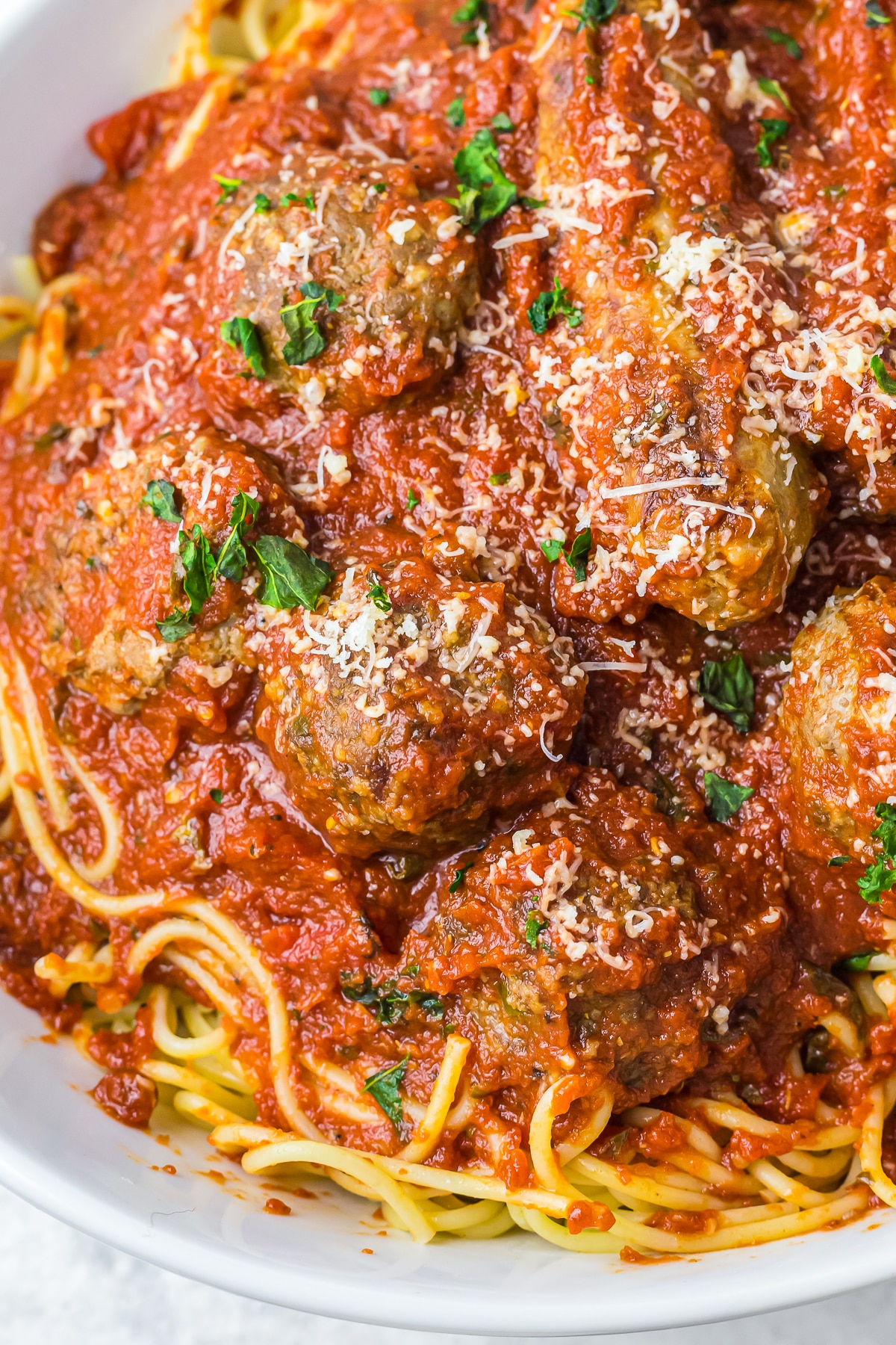 up close image of the best spaghetti sauce in white serving dish