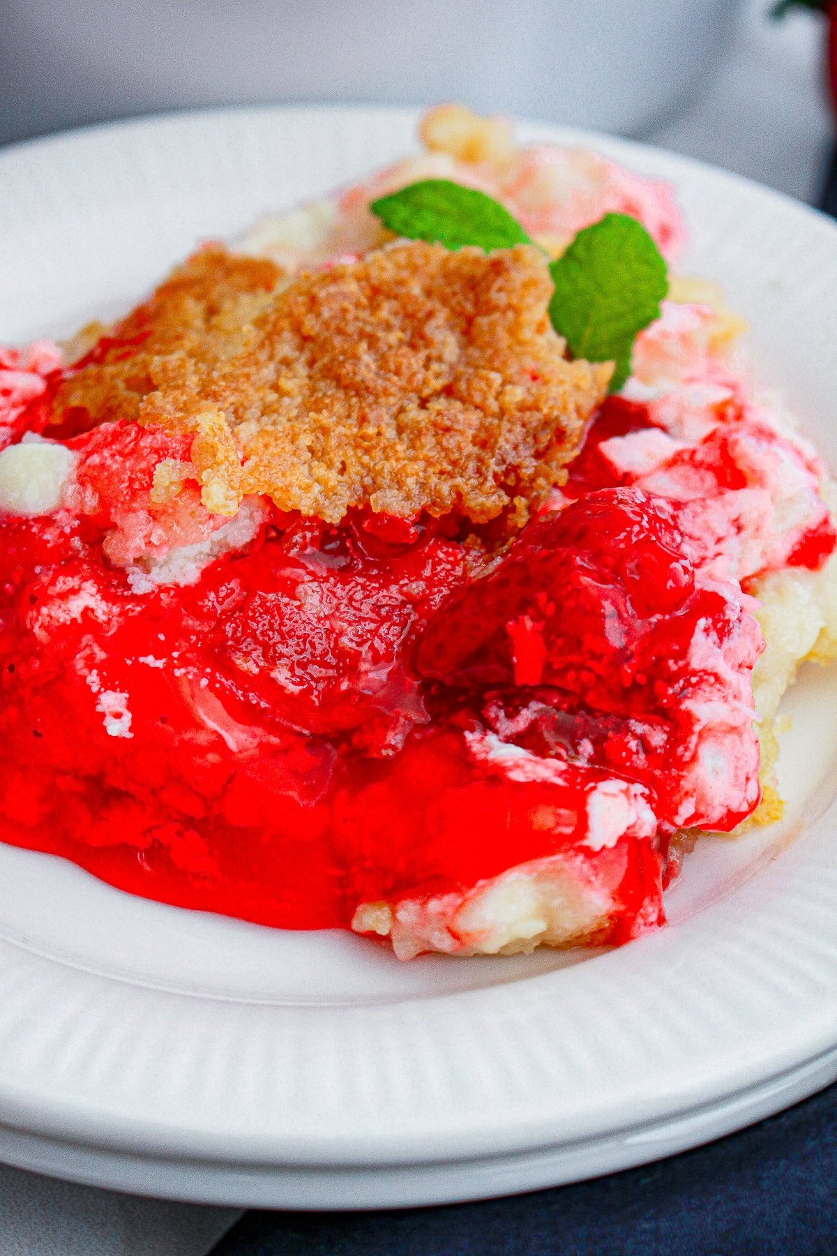Strawberry Dump Cake served on a white plate