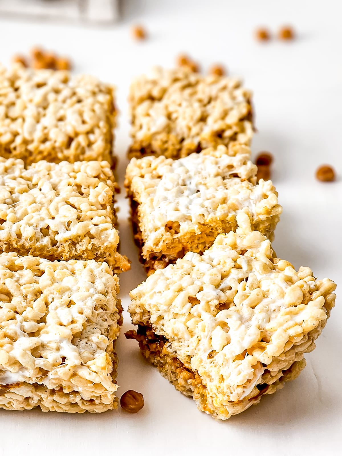 Brown Butter Rice Crispy Treats on parchment paper cut into bars
