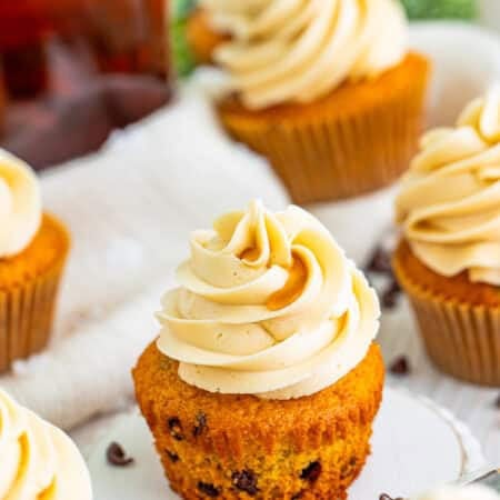 Pancake cupcake piped with a tall swirl of maple buttercream frosting.