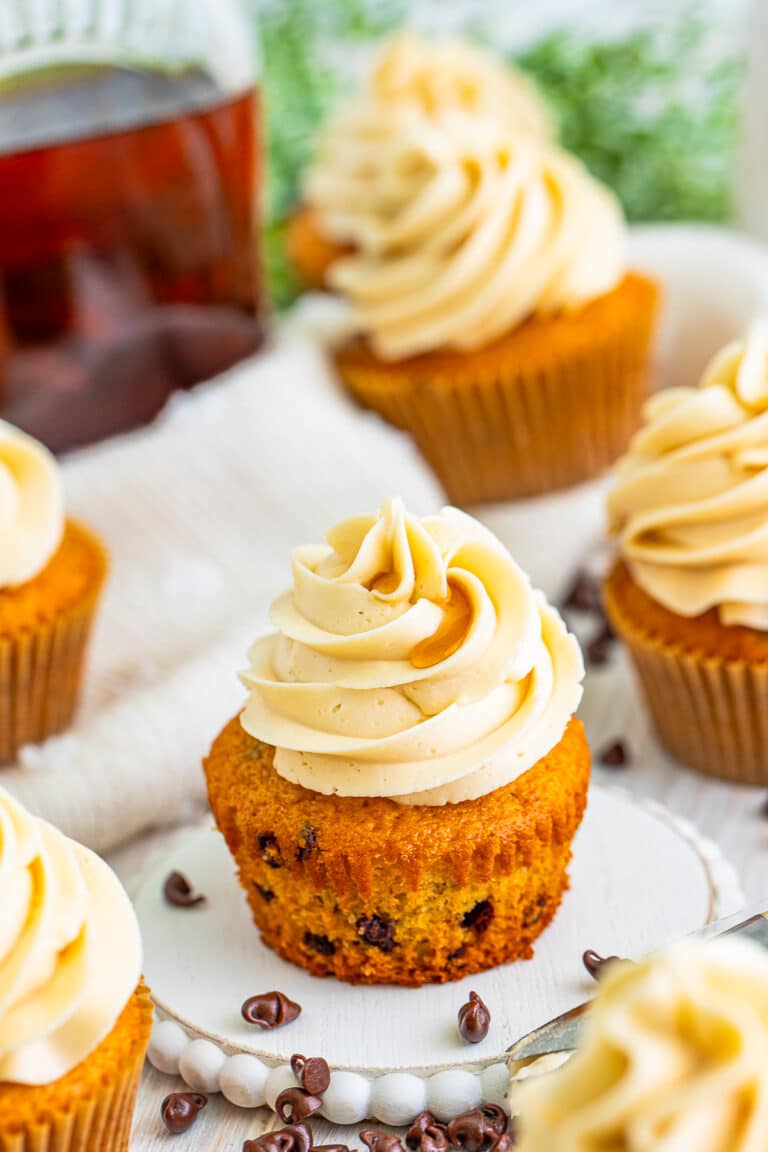 Pancake cupcake piped with a tall swirl of maple buttercream frosting.