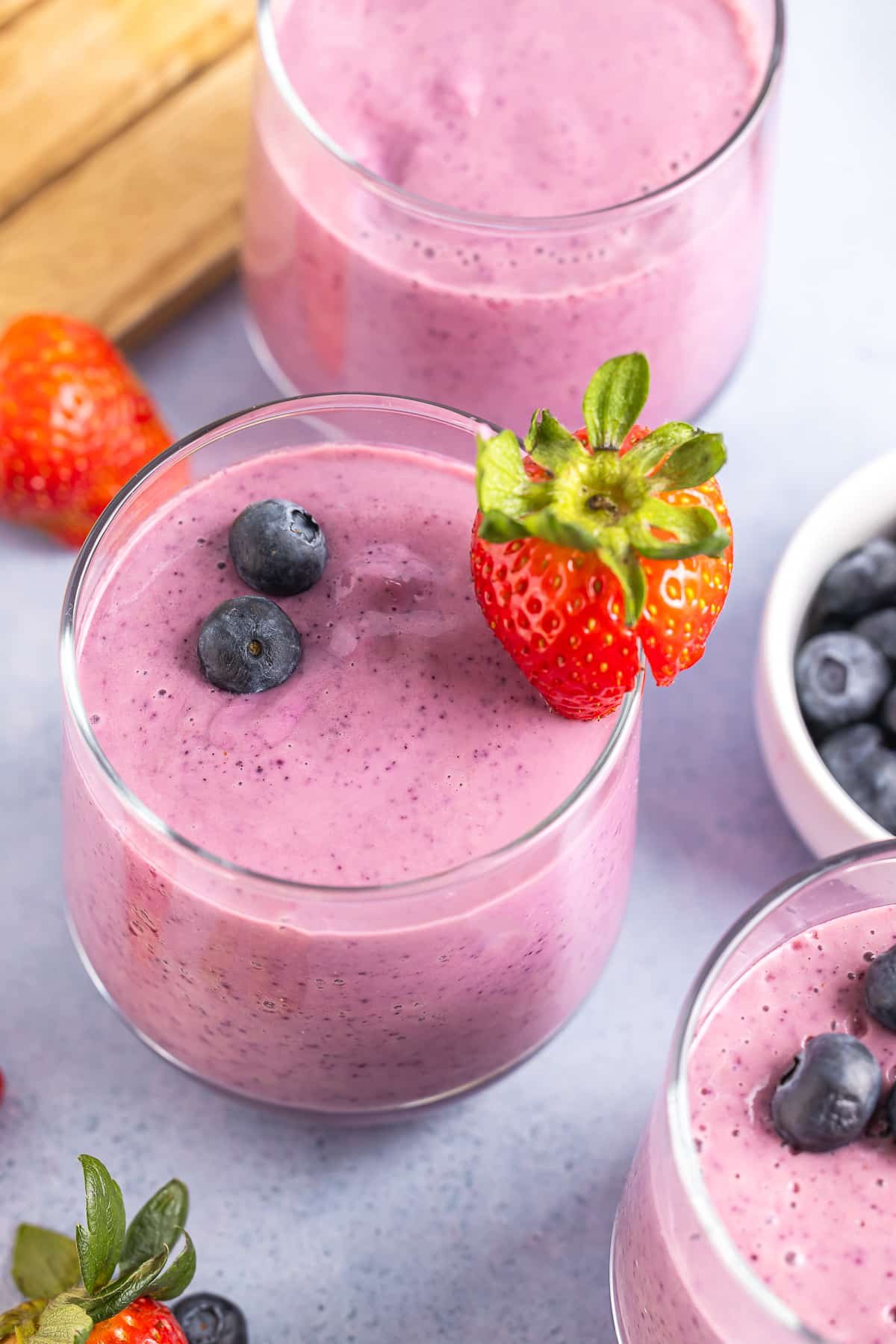 overhead image Yogurt Fruit Smoothie in glass with berries