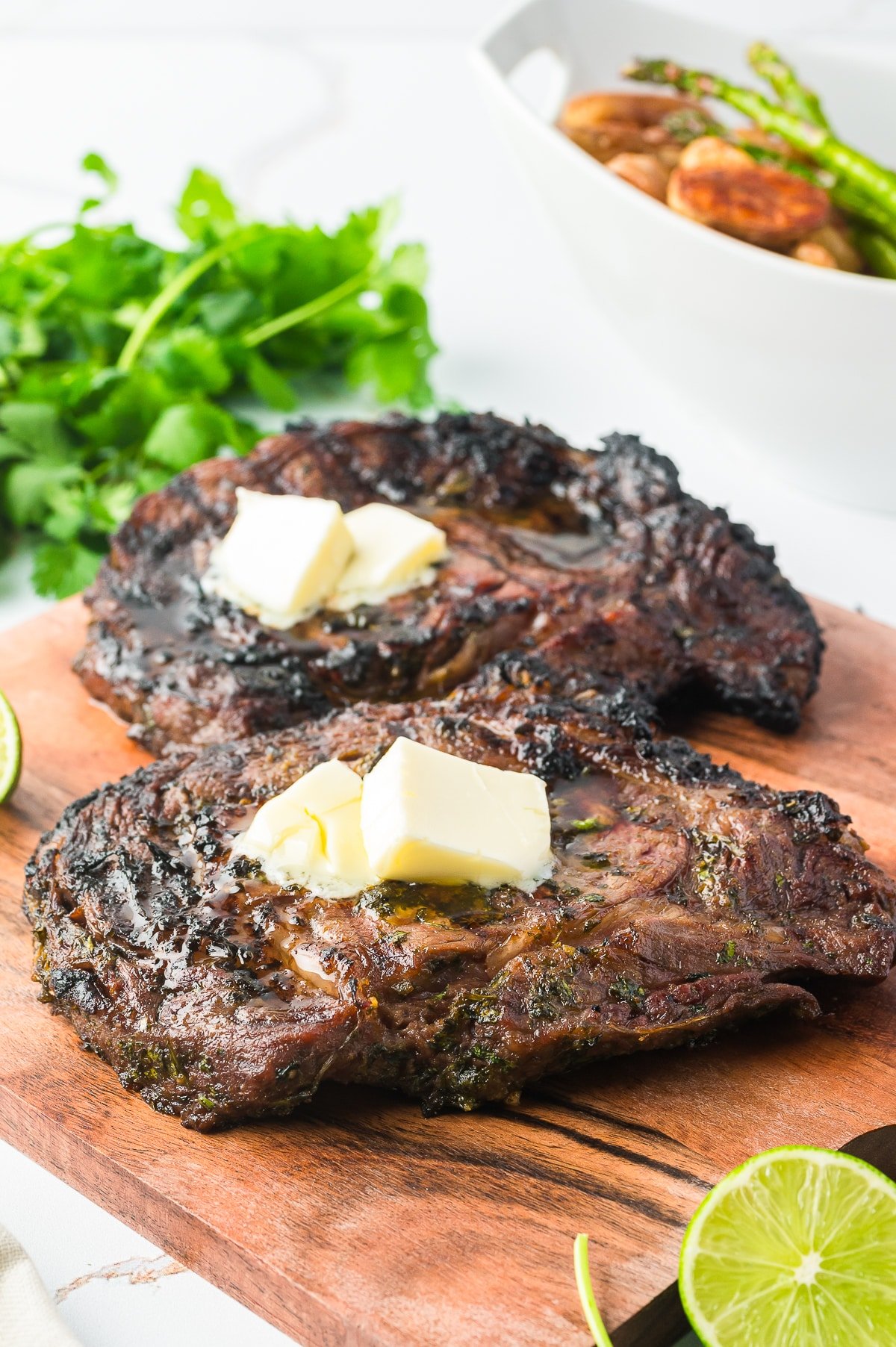 Ribeye Steaks Recipe on a wooden platter