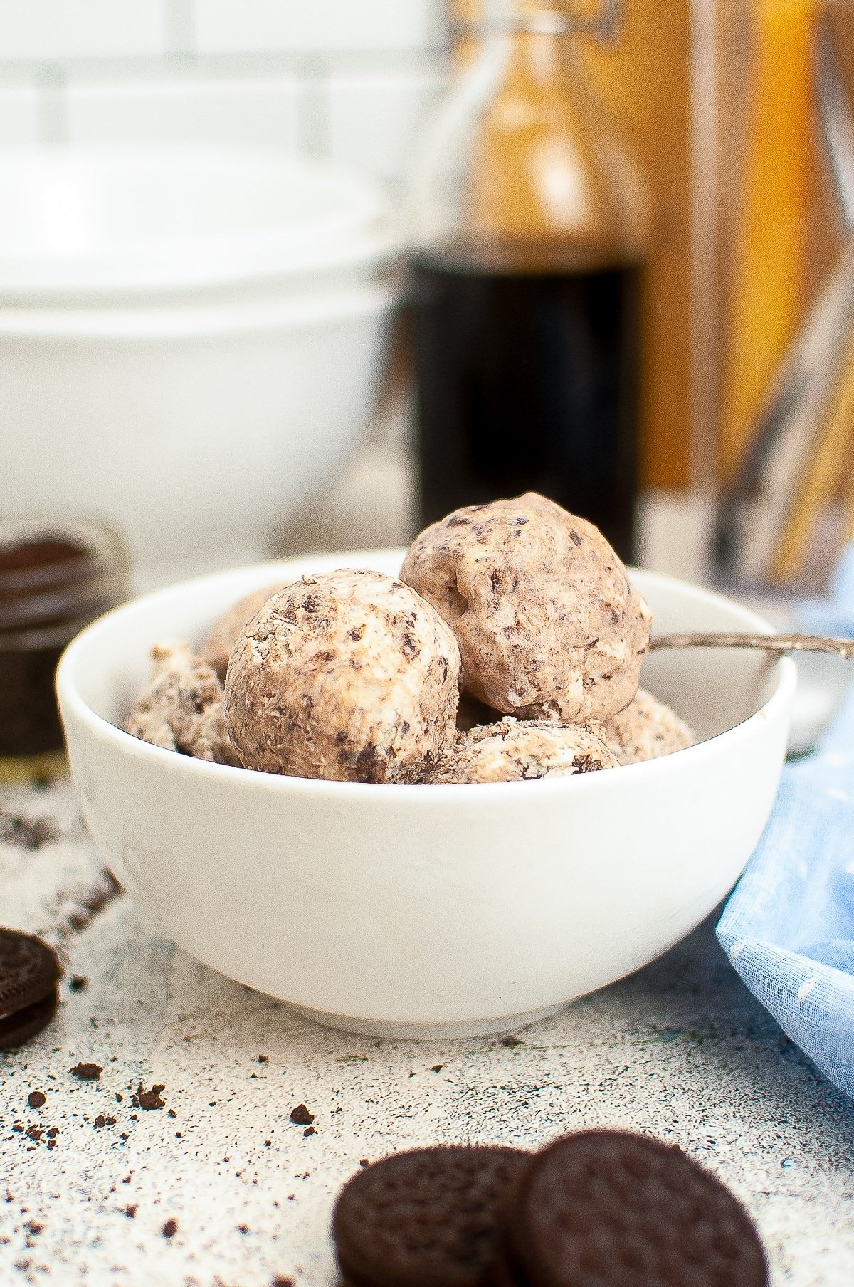 scoops of Cookies and Cream Ice Cream served in a white bowl