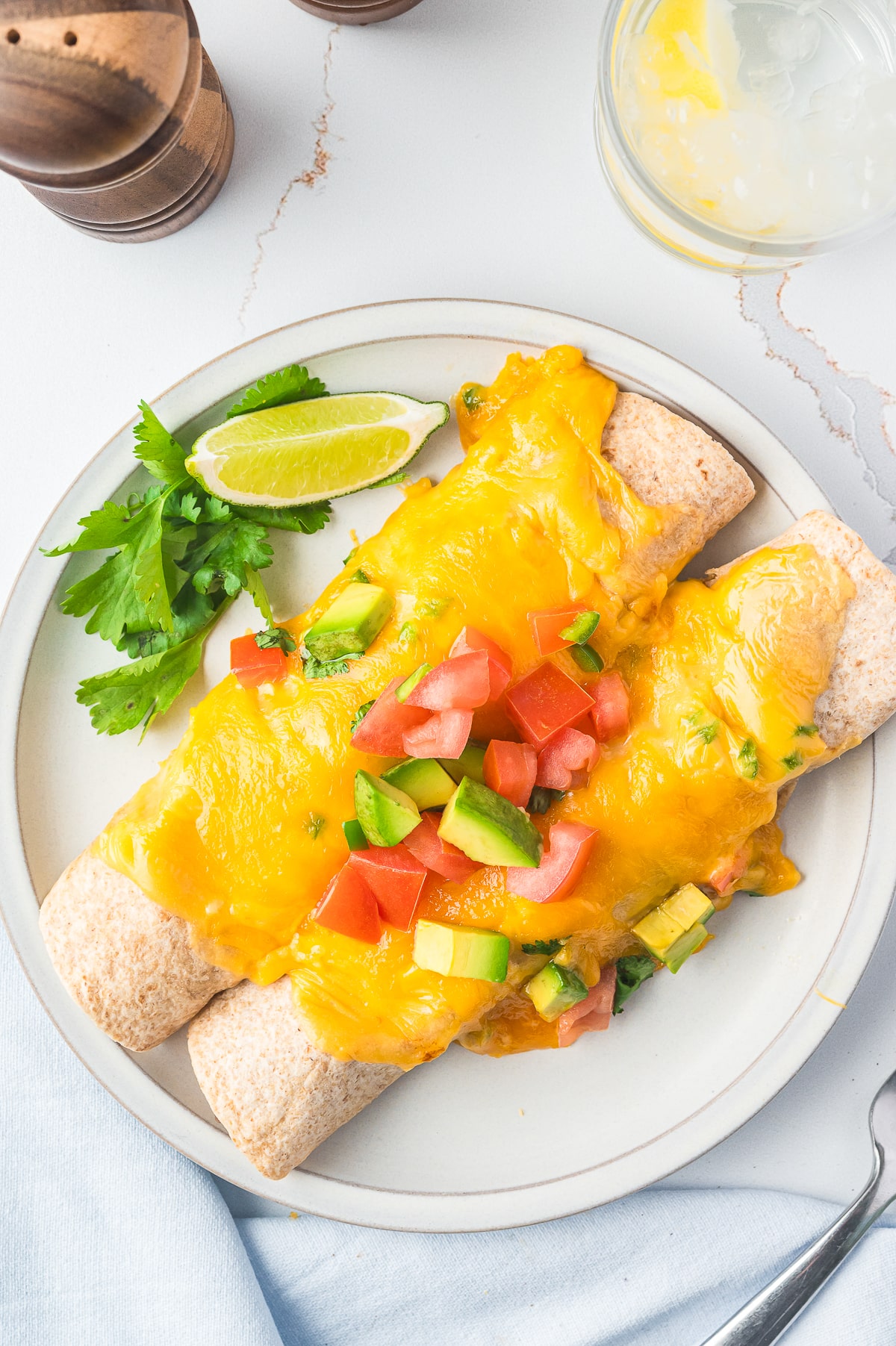 two Breakfast Enchiladas on a white plate