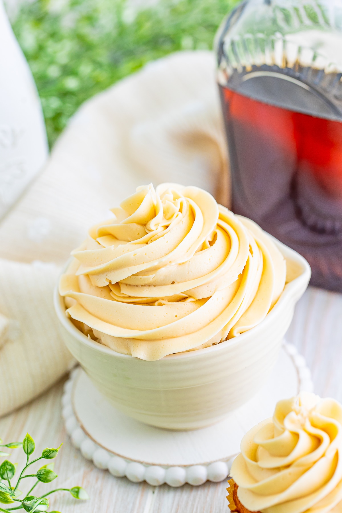 maple frosting piped into a small bowl