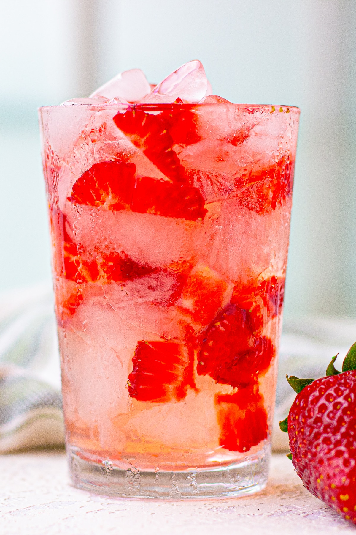 close up image of Strawberry Acai Refresher in a chilled glass