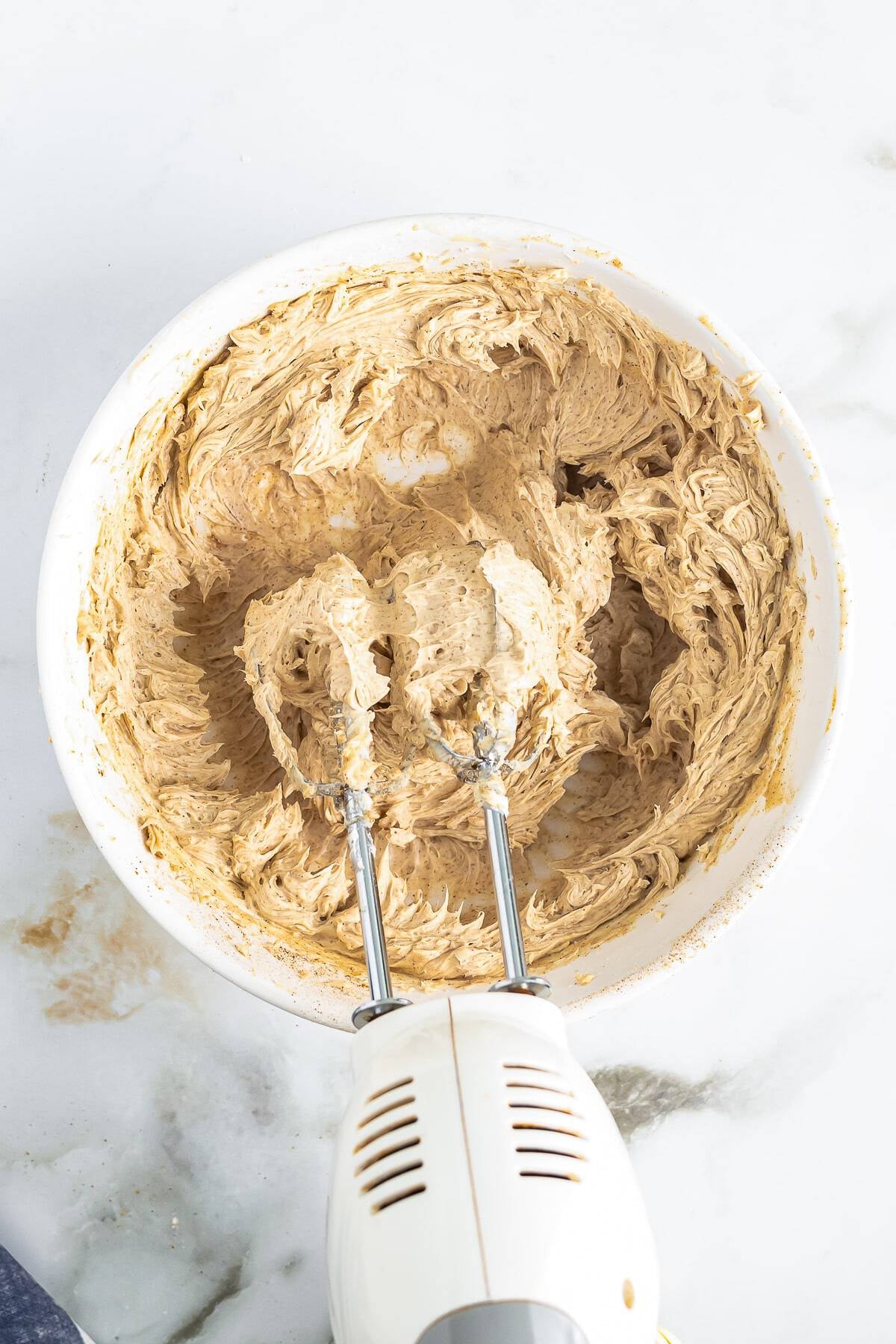 Finished Texas Roadhouse butter whipped smooth in a white bowl.