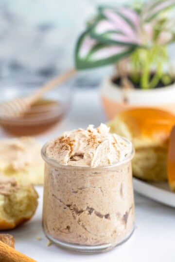 Texas Roadhouse butter recipe whipped and served in a small glass jar.