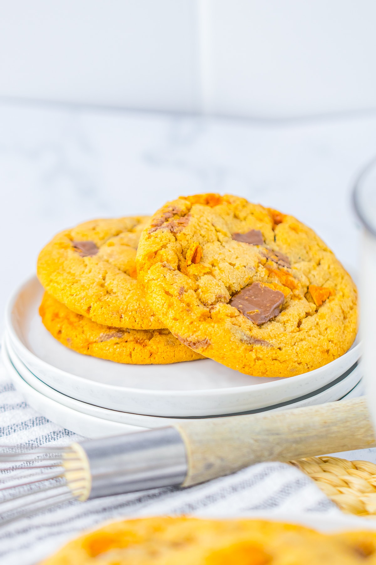 3 Butterfinger Cookies on a small white plate