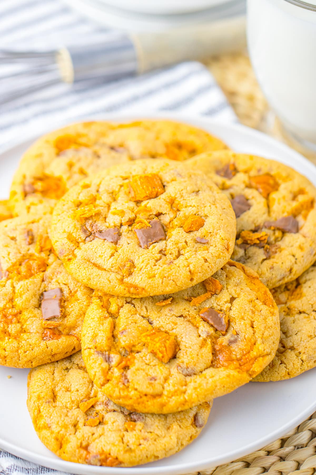 Butterfinger Cookies stacked on a white plate