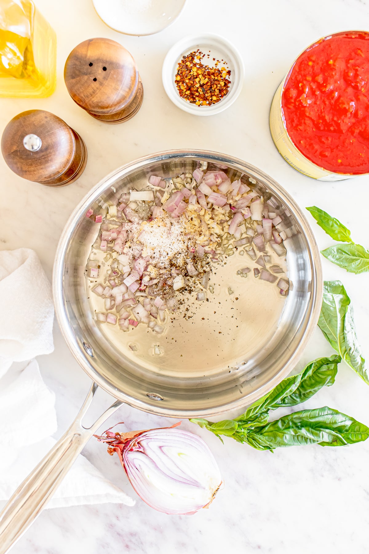 shallots and garlic in the pan for making homemade marinara sauce