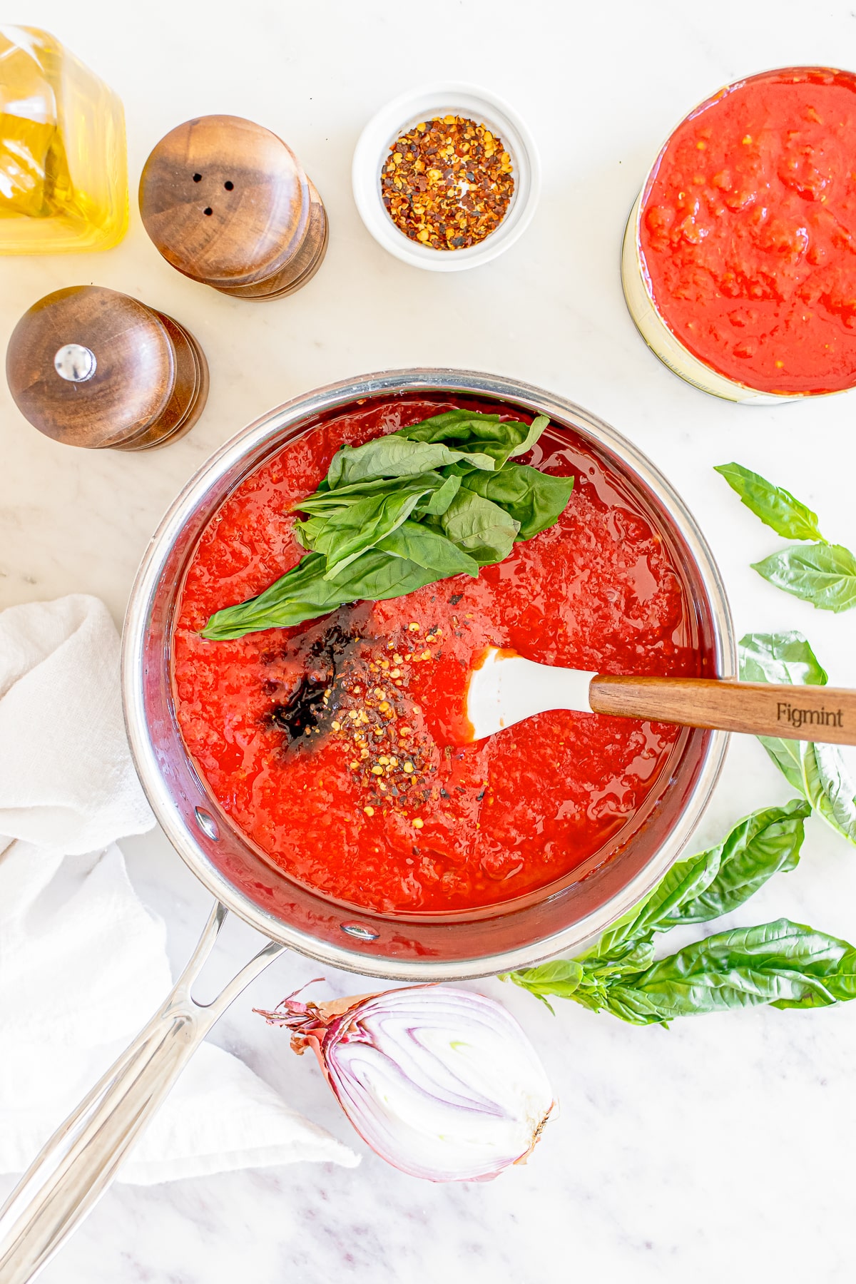 homemade marinara sauce being assembled in a skillet