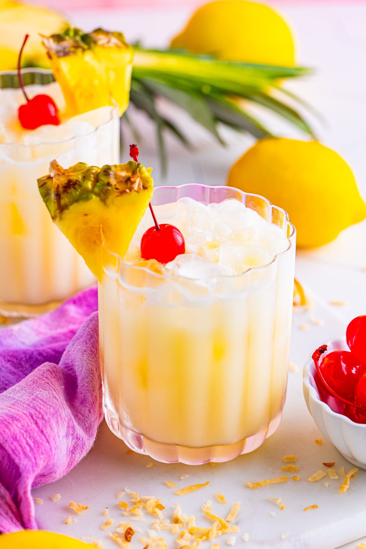 Pineapple Lemonade served in glasses with garnishes