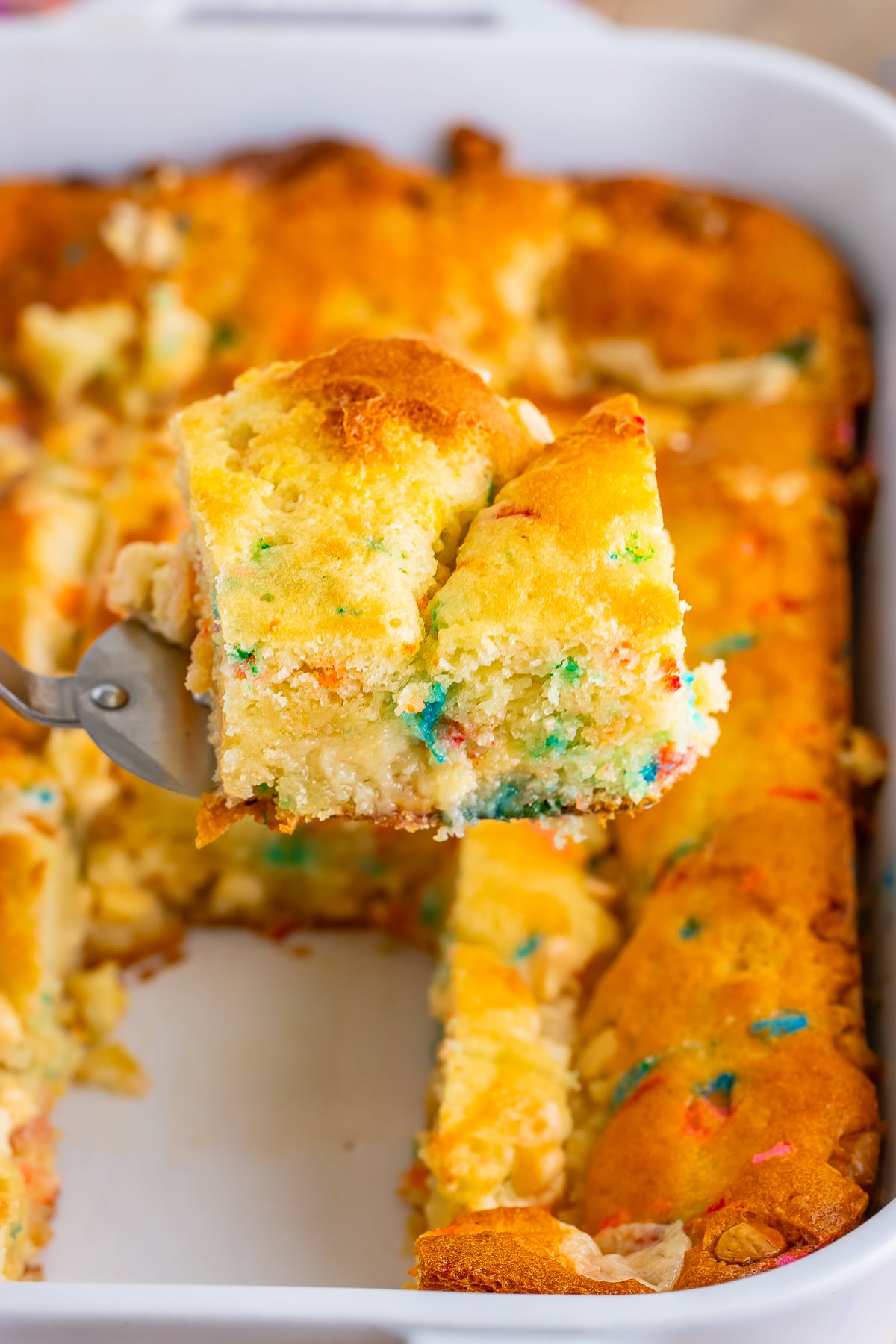 a slice of Earthquake Cake recipe on a spatula being held in air