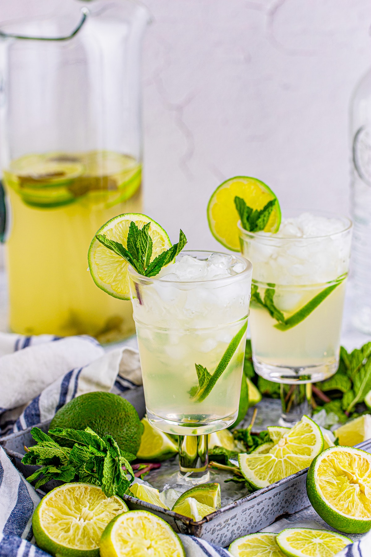 eye level image of Mojitos Recipe served in glasses on a metal tray