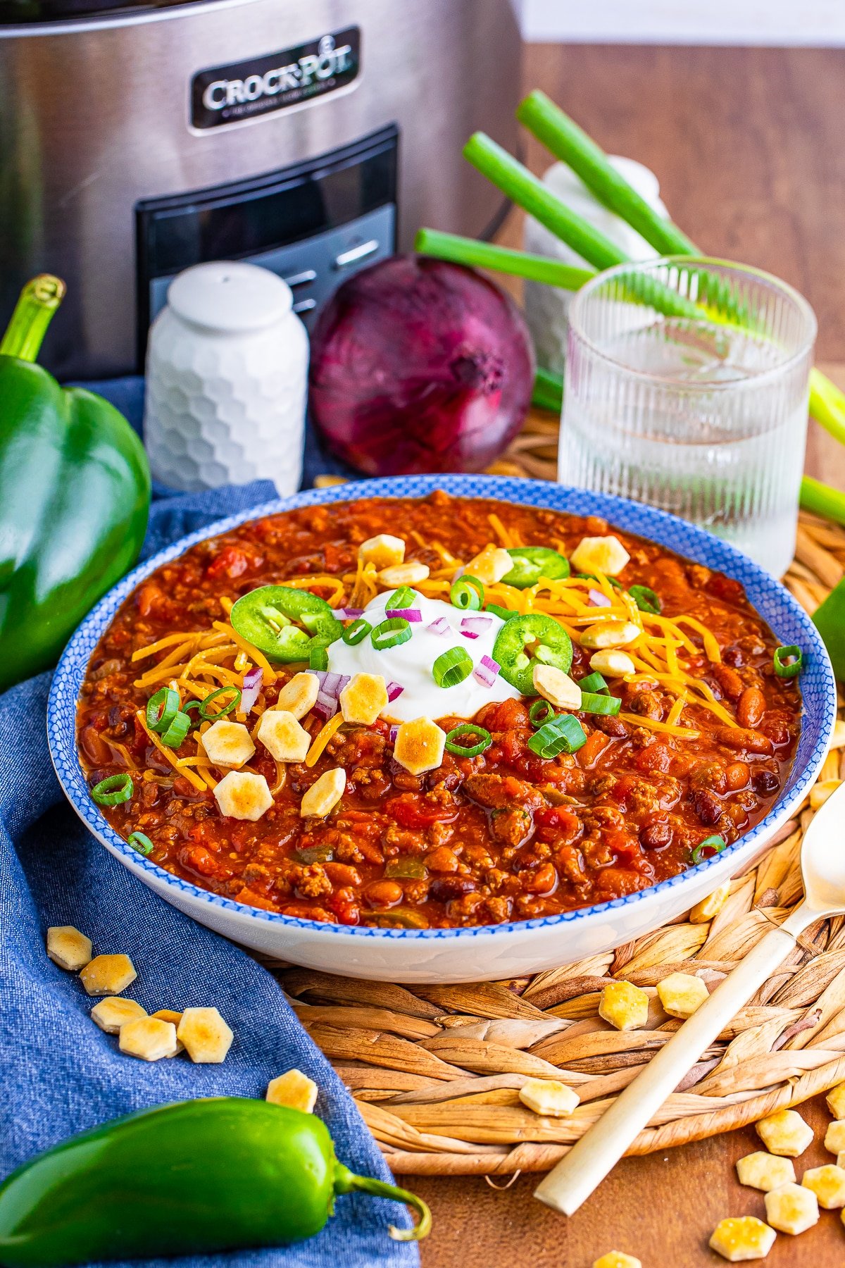 farther away image of Award Winning Chili Recipe served in a bowl with glass of water