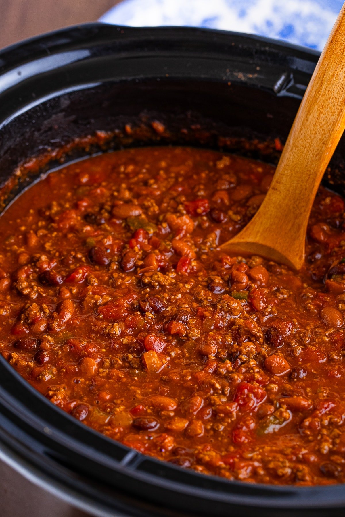 Award Winning Chili Recipe in the slow cooker with a ladel