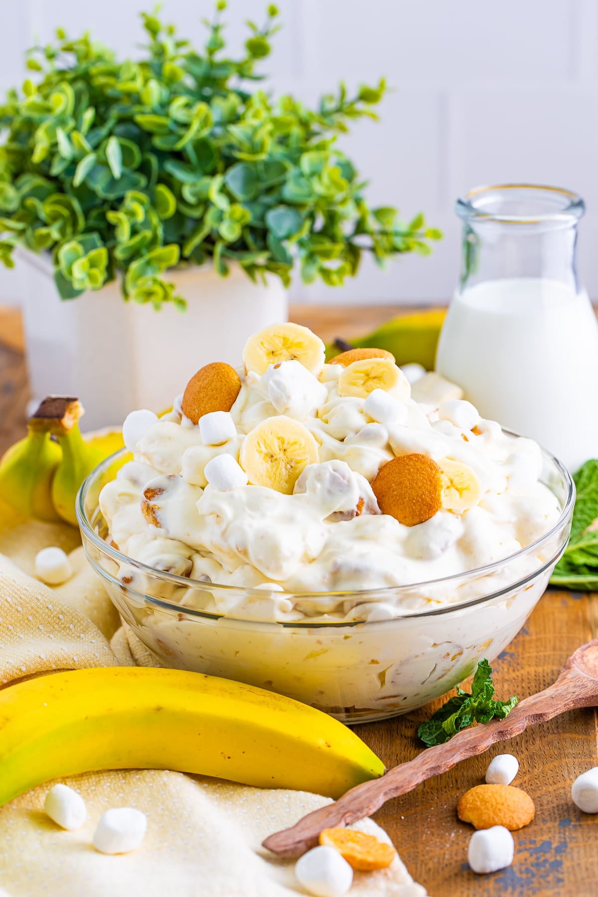 straight on image of Fluff Salad in a clear bowl with bananas