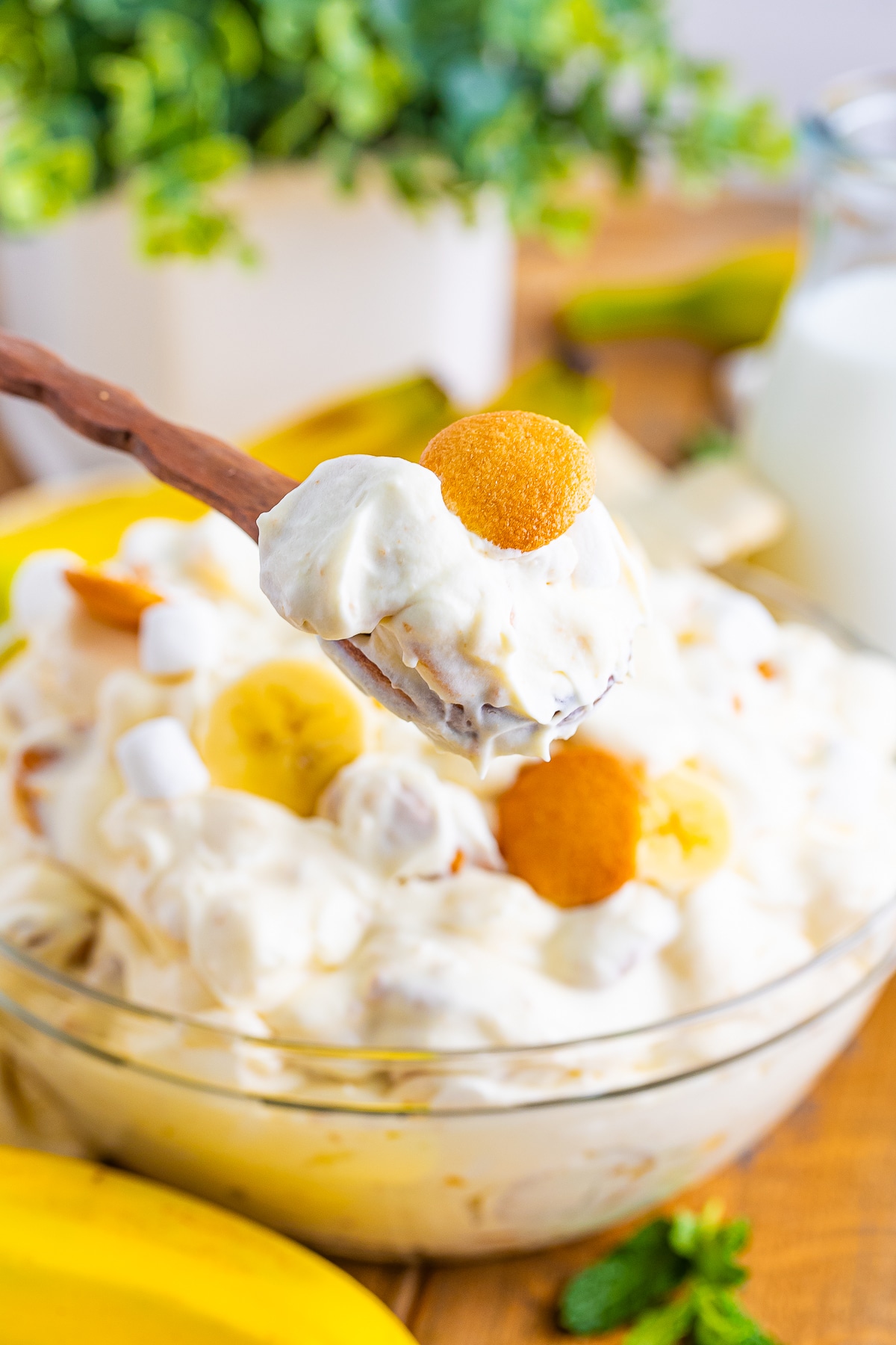 a spoon holding up a bite of Fluff Salad in air
