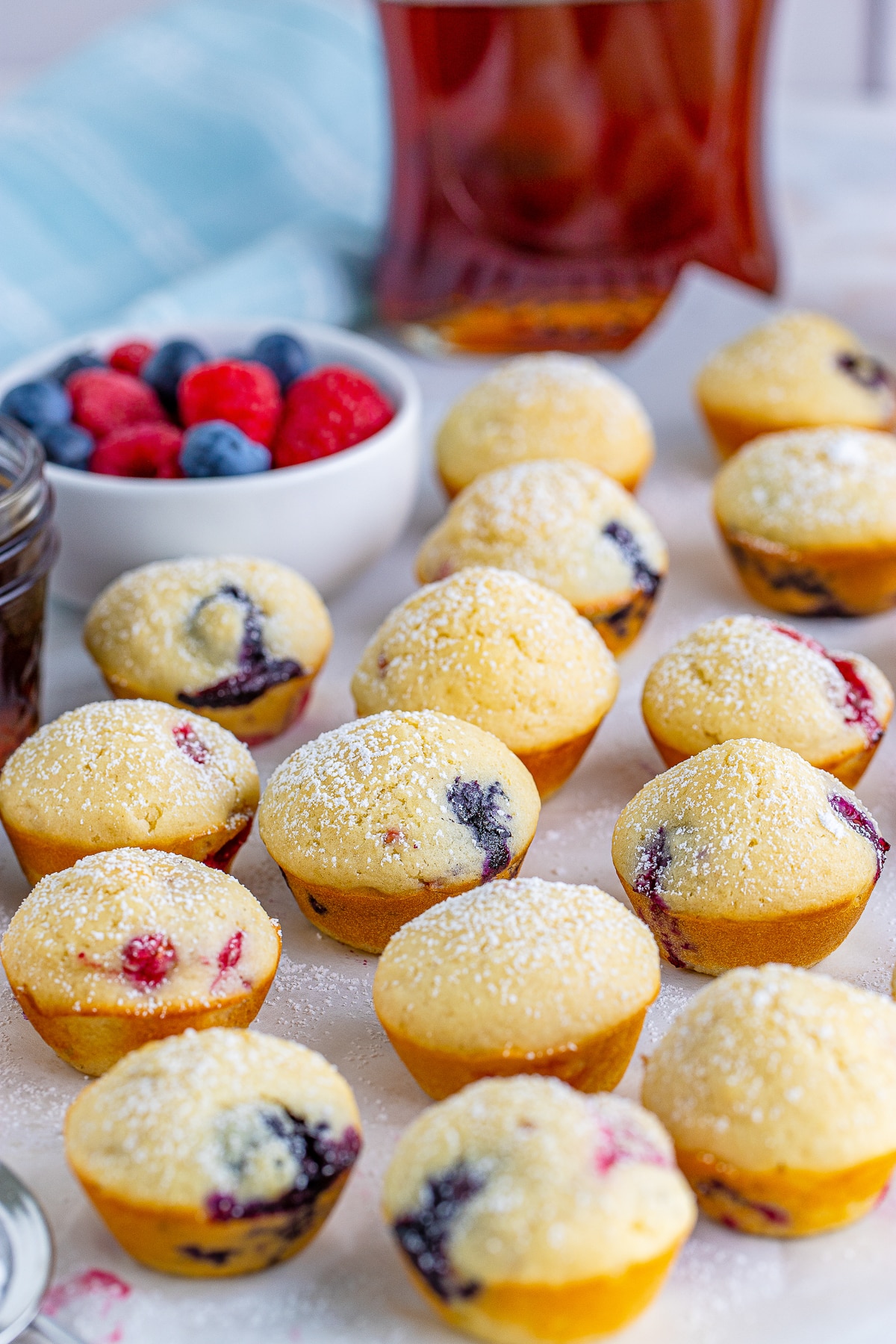 Pancake Bites on white parchment paper, dusted with powdered sugar