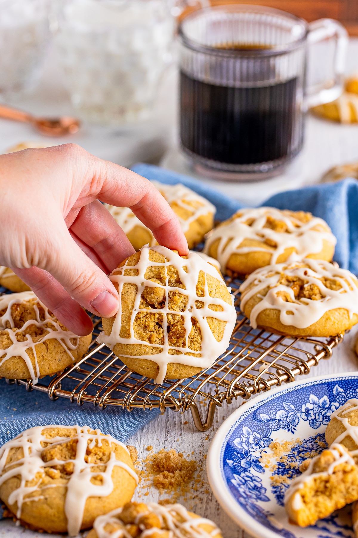 a hand holding up a finished Coffee Cake Cookies