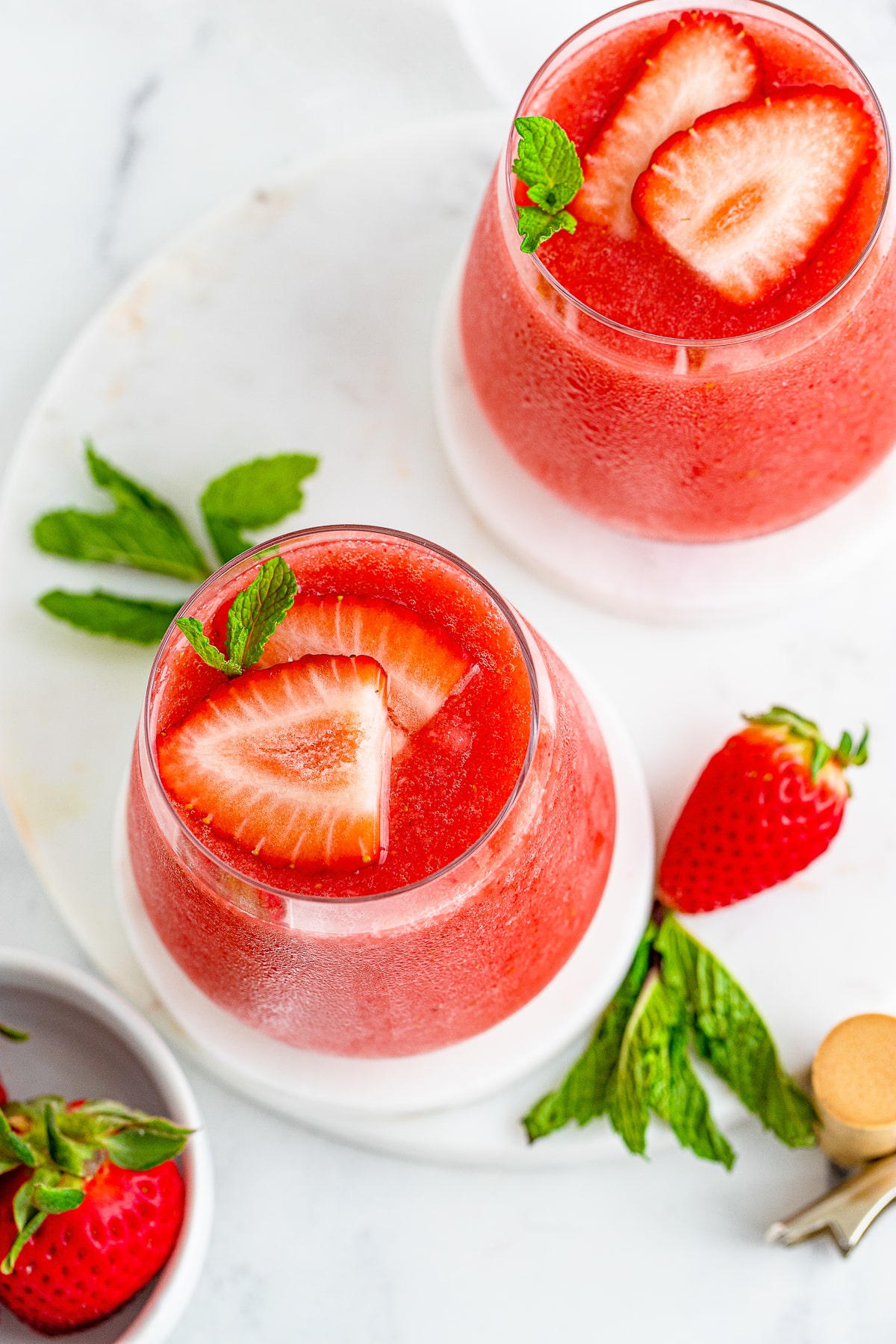 overhead image of Wine Slushies in glasses with garnish