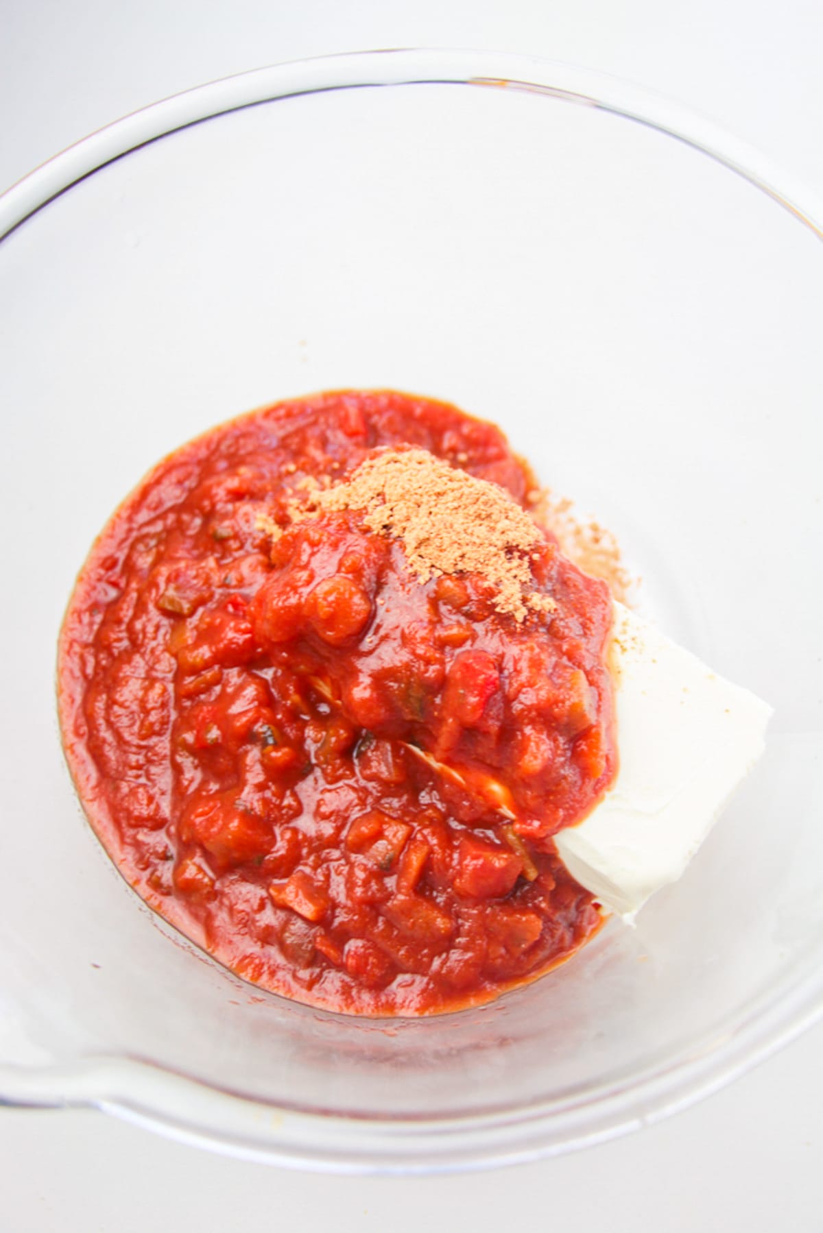 showing the first step of making Taco Dip Recipe