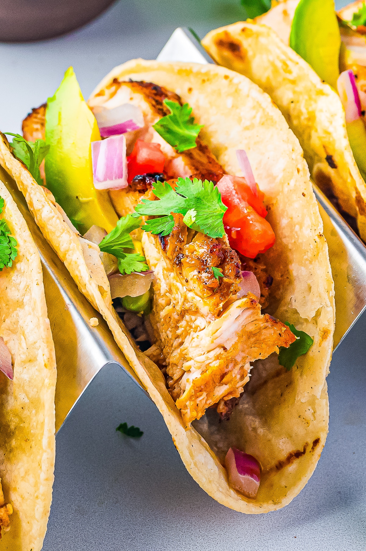 finished Chicken Tacos in a metal taco serving tray